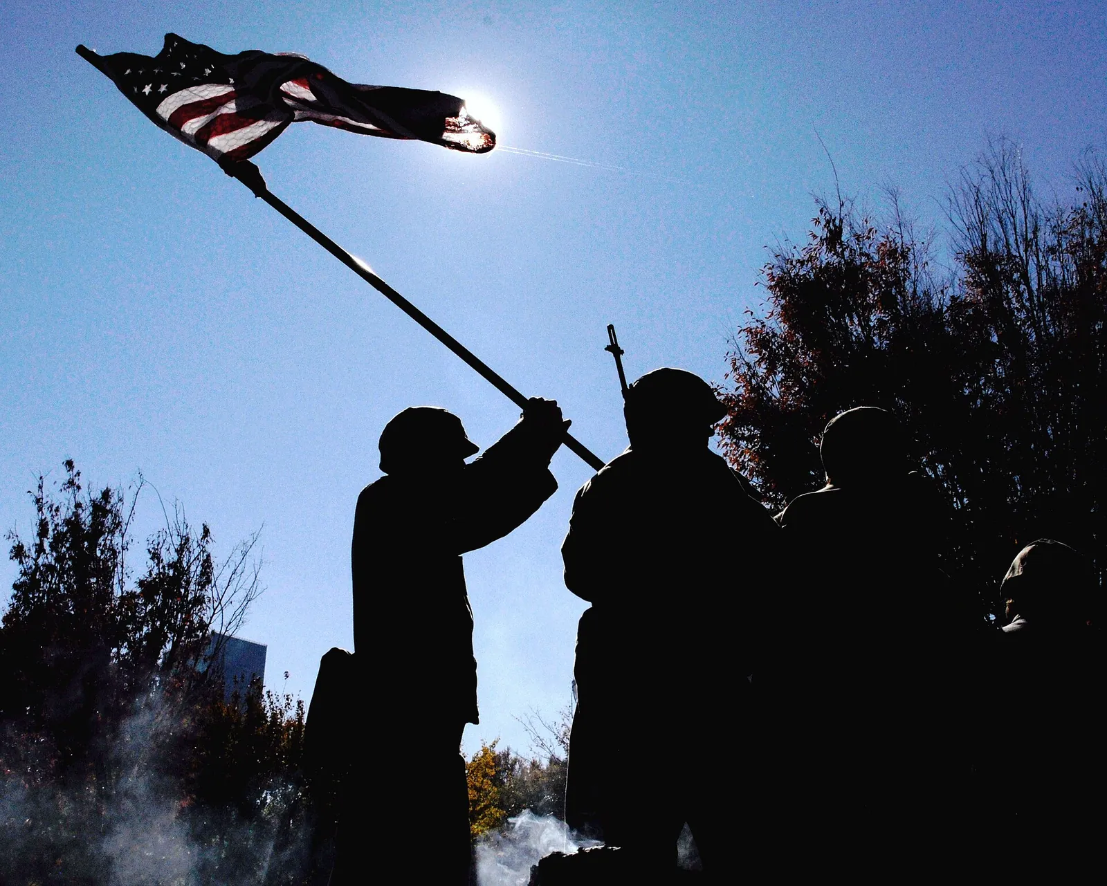 A re-creation of the Iwo Jima flag raising rolls through Atlanta's Veterans Day Parade