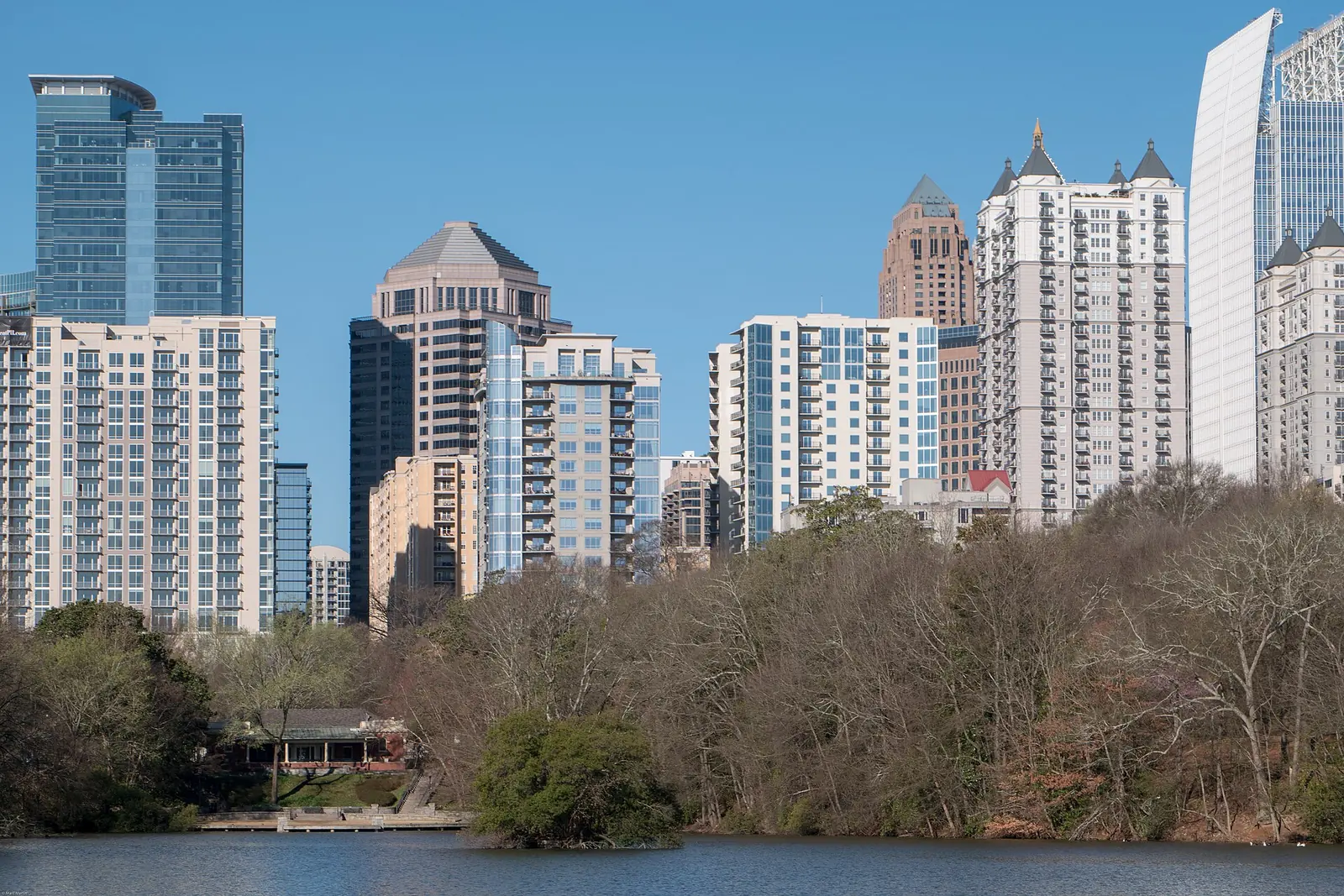 Lake Clara Meer and the Midtown skyline in Piedmont Park, which has a 2.5-acre off-leash dog area.
