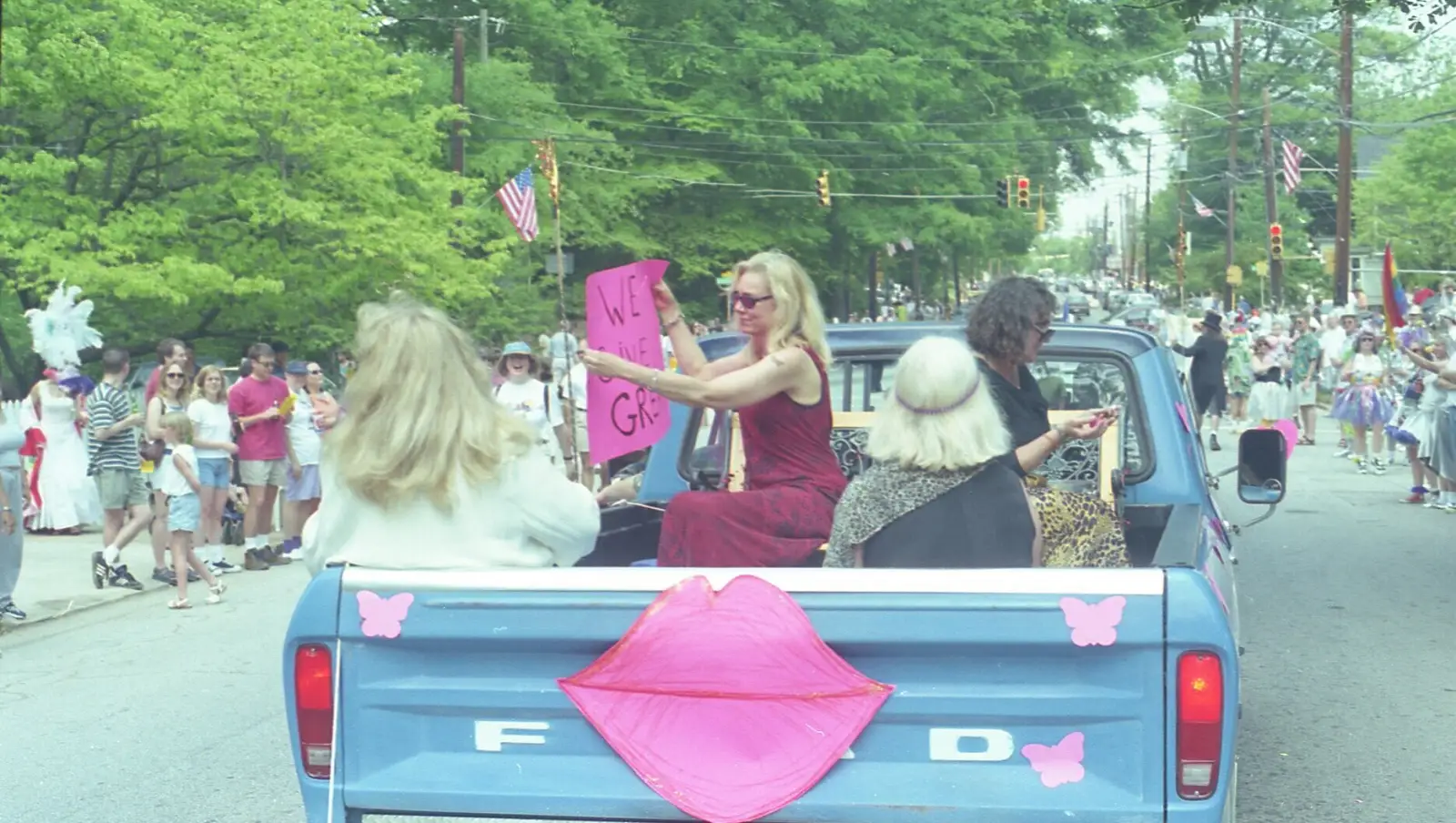 A float rolls past crowds on the Inman Park Festival parade route.