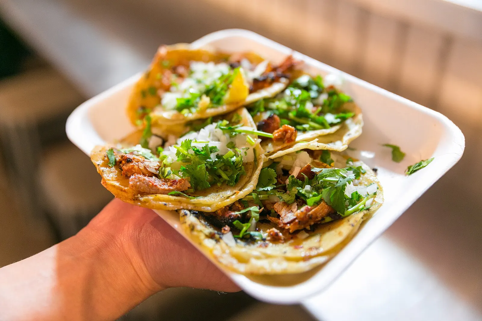 Al pastor tacos on a plate. The photo was not taken at an Atlanta restaurant.